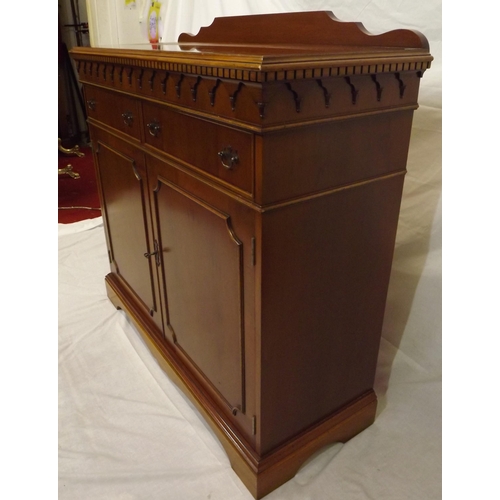 20 - Edwardian style yew cabinet with dentil frieze, two frieze drawers with shelved press under, on brac... 