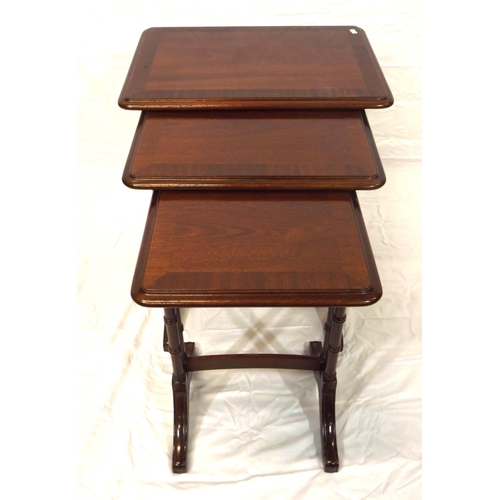 26 - Edwardian style inlaid and crossbanded mahogany nest of three tables, urned columns and bracket feet