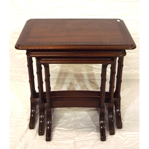 26 - Edwardian style inlaid and crossbanded mahogany nest of three tables, urned columns and bracket feet