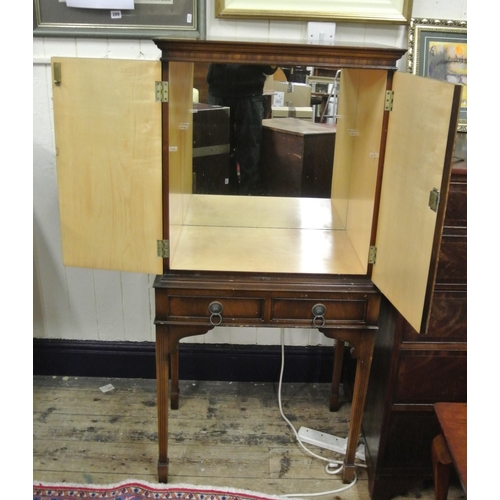 39 - Edwardian drinks cabinet with lined mirrored interior, two drawers with brass drop handles, on reede... 