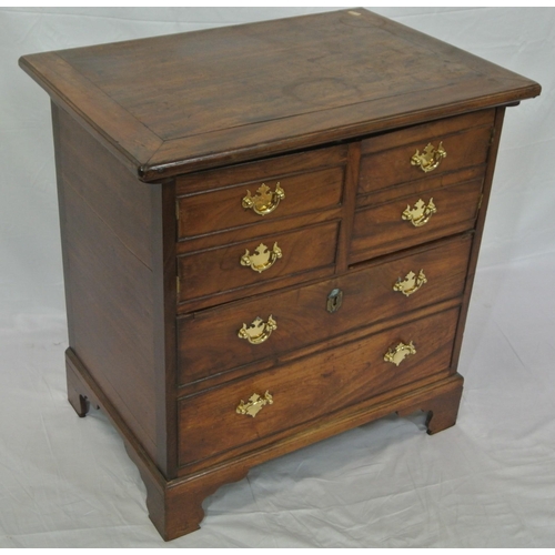 46 - Edwardian mahogany commode with lift-up lid, chest of drawer front with drop handles, on bracket fee... 