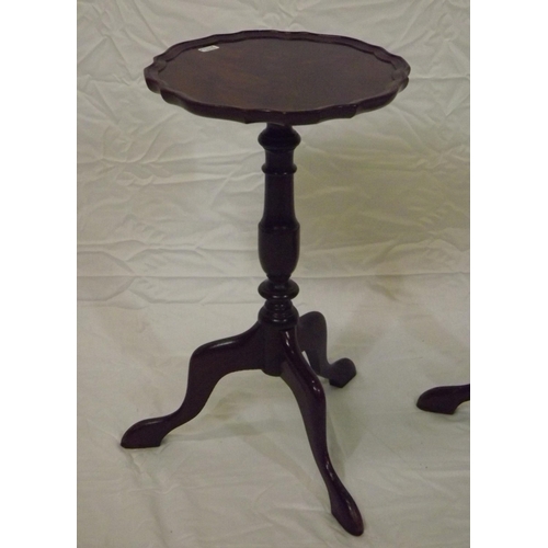 57 - Pair of Edwardian mahogany lamp tables with piecrust borders, vase turned columns, on hipped tripods