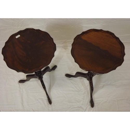 57 - Pair of Edwardian mahogany lamp tables with piecrust borders, vase turned columns, on hipped tripods