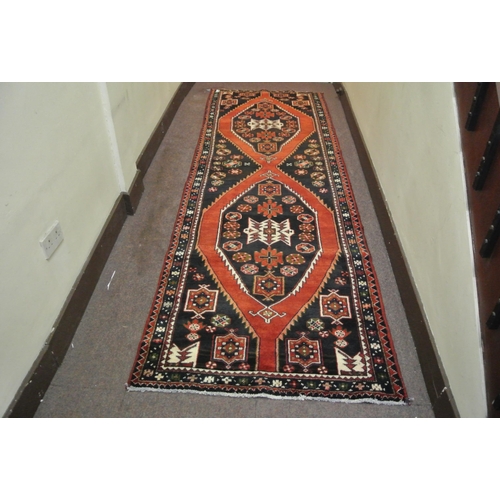 58 - Terracotta ground Persian hamadan runner with aztec medallion design 329x113