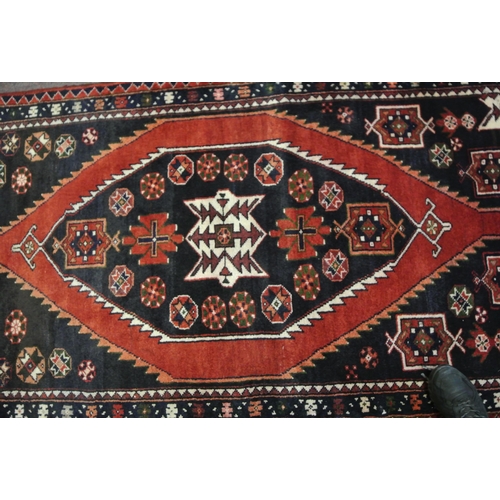 58 - Terracotta ground Persian hamadan runner with aztec medallion design 329x113