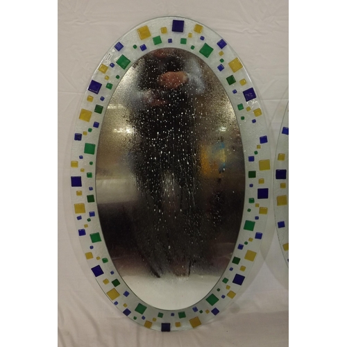 62 - Pair of oval Murano style wall mirrors with ornate multi-coloured glass decoration