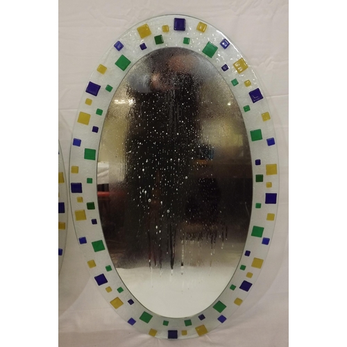 62 - Pair of oval Murano style wall mirrors with ornate multi-coloured glass decoration