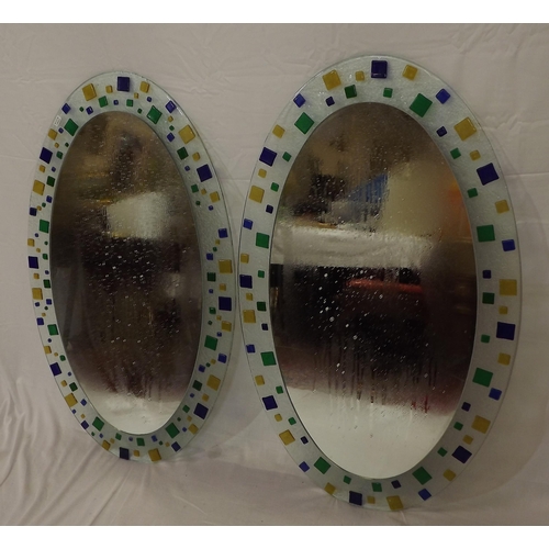 62 - Pair of oval Murano style wall mirrors with ornate multi-coloured glass decoration