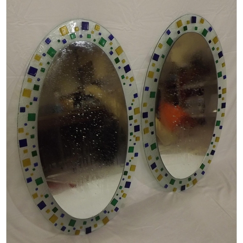 62 - Pair of oval Murano style wall mirrors with ornate multi-coloured glass decoration