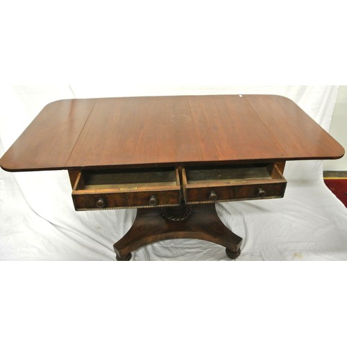 140 - Regency style mahogany sofa table with drop leaves, reeded borders, on shaped column on hipped quadr... 