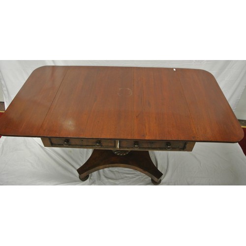 140 - Regency style mahogany sofa table with drop leaves, reeded borders, on shaped column on hipped quadr... 