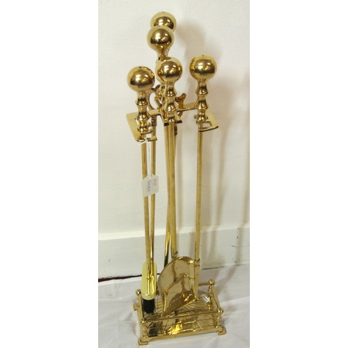 143 - Brass companion set on stand with railed base and ball top
