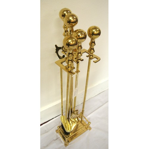 143 - Brass companion set on stand with railed base and ball top
