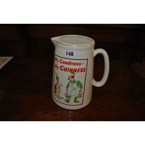 19 - Guinness advertising ewer with figured decoration and shaped handle