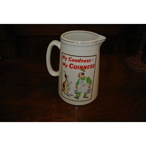19 - Guinness advertising ewer with figured decoration and shaped handle