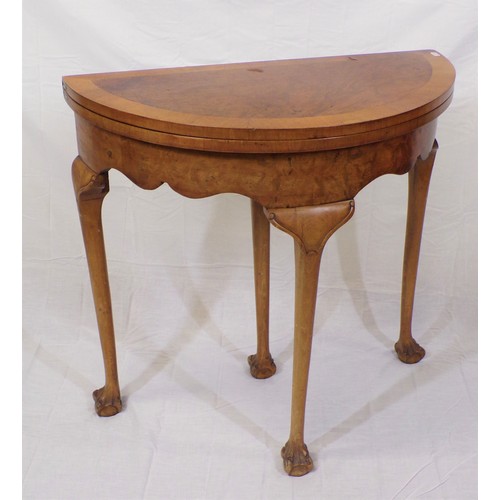 180 - Edwardian walnut and satinwood crossbanded demi lune card table with fold-over top, pull-out support... 
