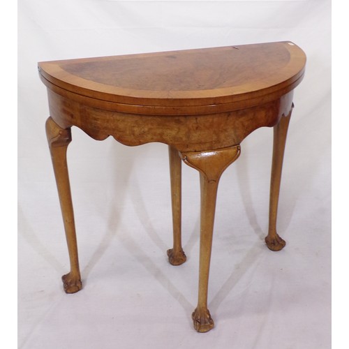 180 - Edwardian walnut and satinwood crossbanded demi lune card table with fold-over top, pull-out support... 