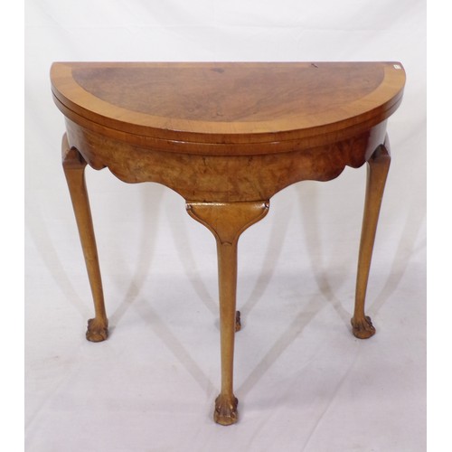 180 - Edwardian walnut and satinwood crossbanded demi lune card table with fold-over top, pull-out support... 