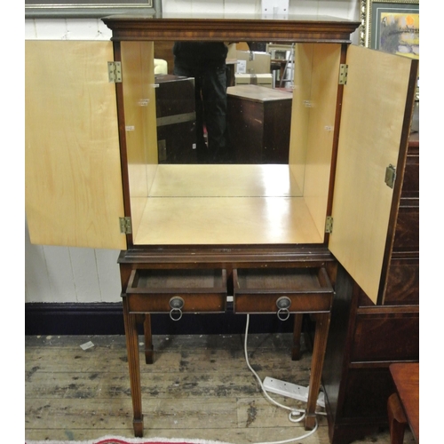 10 - Edwardian drinks cabinet with lined mirrored interior, two drawers with brass drop handles, on reede... 