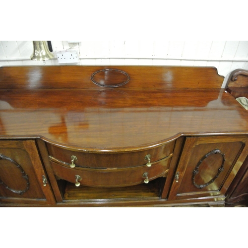 65 - Edwardian mahogany bow fronted sideboard with tray back, two central drawers, shelved side presses w... 