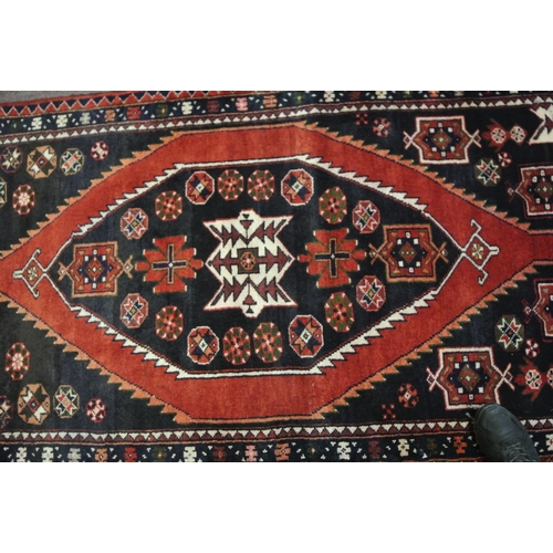 68 - Terracotta ground Persian hamadan runner with aztec medallion design 329x113