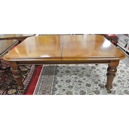 90 - Victorian mahogany extending dining table with rounded borders, on baluster turned tapering legs wit... 