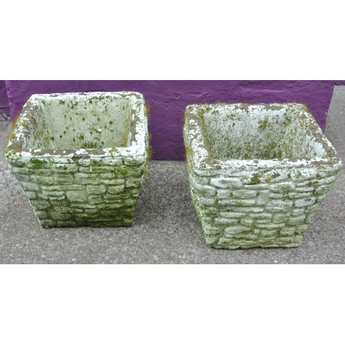 128 - Pair of old stone square garden vases with wicker edges