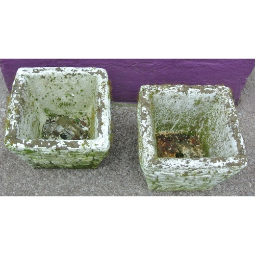 128 - Pair of old stone square garden vases with wicker edges