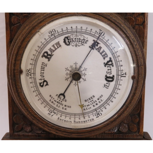 134 - Edwardian oak cased aneroid barometer with thermometer, scroll carving