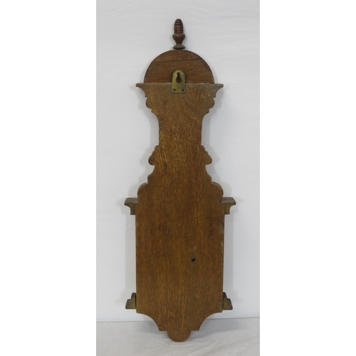 134 - Edwardian oak cased aneroid barometer with thermometer, scroll carving