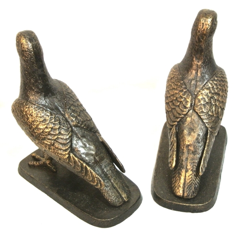 169 - Pair of Edwardian style cast iron figures of birds on shaped stands