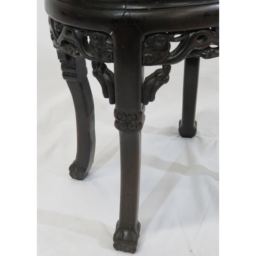 24 - Oriental oval teak stool with foliate and scroll carving