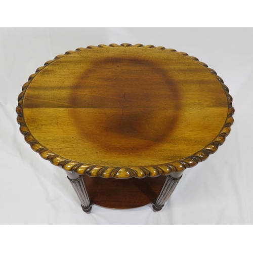 26 - Victorian style oval two tier occasional table with carved borders, and turned columns