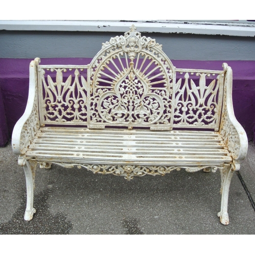 285 - Victorian style cast iron garden seat with domed back, foliate and scroll decoration, shaped legs, s... 