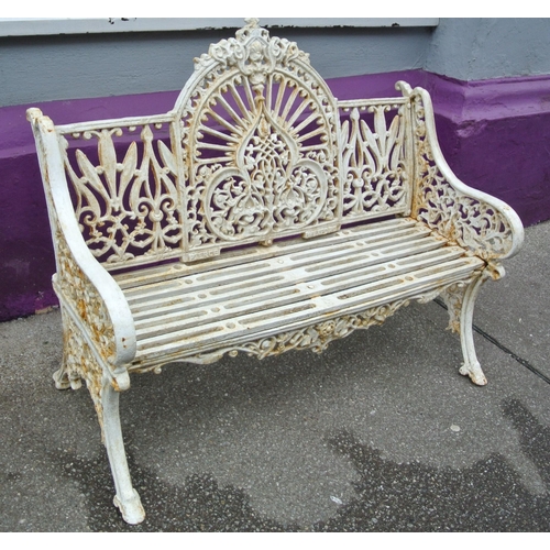 285 - Victorian style cast iron garden seat with domed back, foliate and scroll decoration, shaped legs, s... 