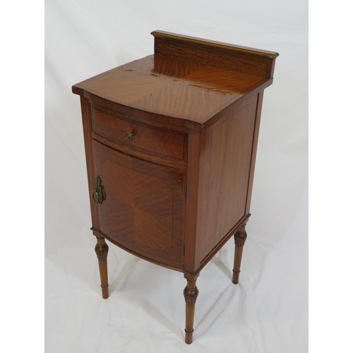 39 - Edwardian inlaid satinwood locker with bowed drawer and press under, brass handles, on turned taperi... 