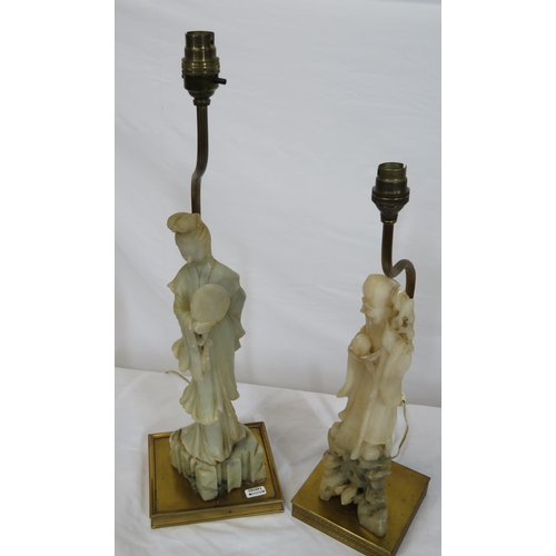 52 - Two Oriental alabaster figured lamps with square brass bases