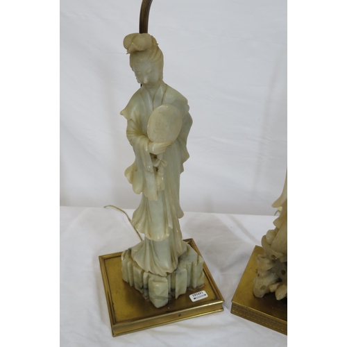 52 - Two Oriental alabaster figured lamps with square brass bases