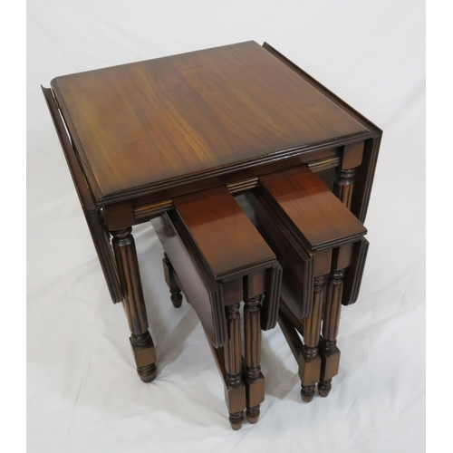 61 - Edwardian nest of three drop leaf tables with reeded borders, reeded turned columns, on round legs