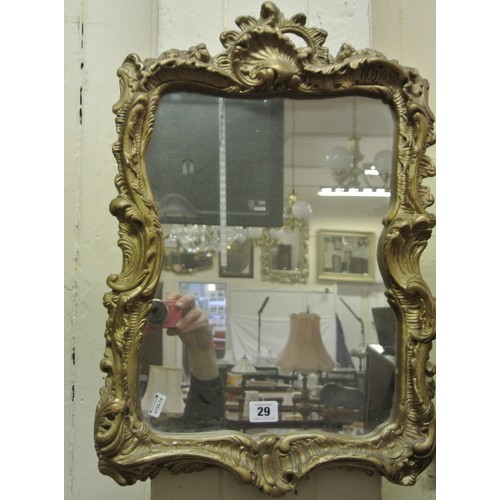 29 - Gilt framed wall mirror with scroll decoration