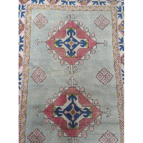 196 - Iranian style red ground hearth rug with diamond pattern. 200 x140 cm