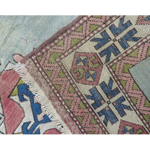 196 - Iranian style red ground hearth rug with diamond pattern. 200 x140 cm