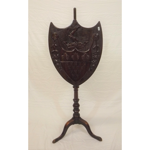 49 - Victorian mahogany pole screen having coat of arms and floral decorated shield shaped shade, turned ... 