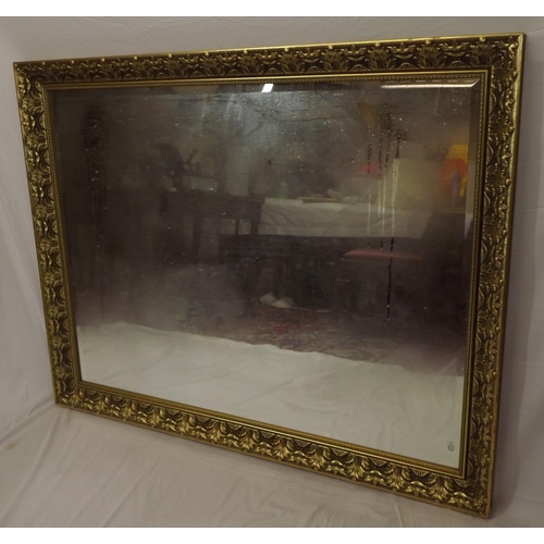 64 - Edwardian design gilt framed bevelled glass wall mirror with ornate foliate decorated frame