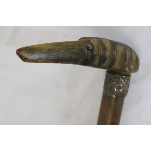 104 - Edwardian walking stick with worked metal mounts and shaped handle