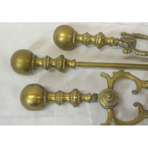 122 - Set of three Victorian style brass fire implements with ball shaped tops