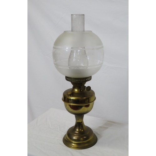 137 - Victorian style brass table oil lamp with foliate decorated shade