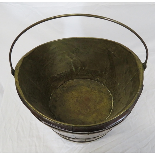 162 - Georgian walnut oval peat bucket of tapering form with brass banding and bucket inset