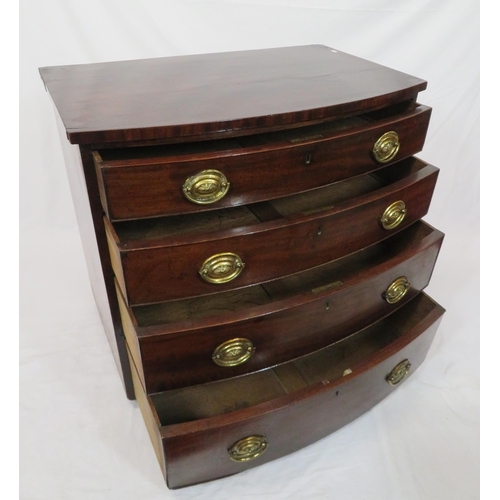 180 - Mahogany bow fronted chest of four drawers with brass drop handles, on bun feet