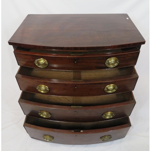 180 - Mahogany bow fronted chest of four drawers with brass drop handles, on bun feet